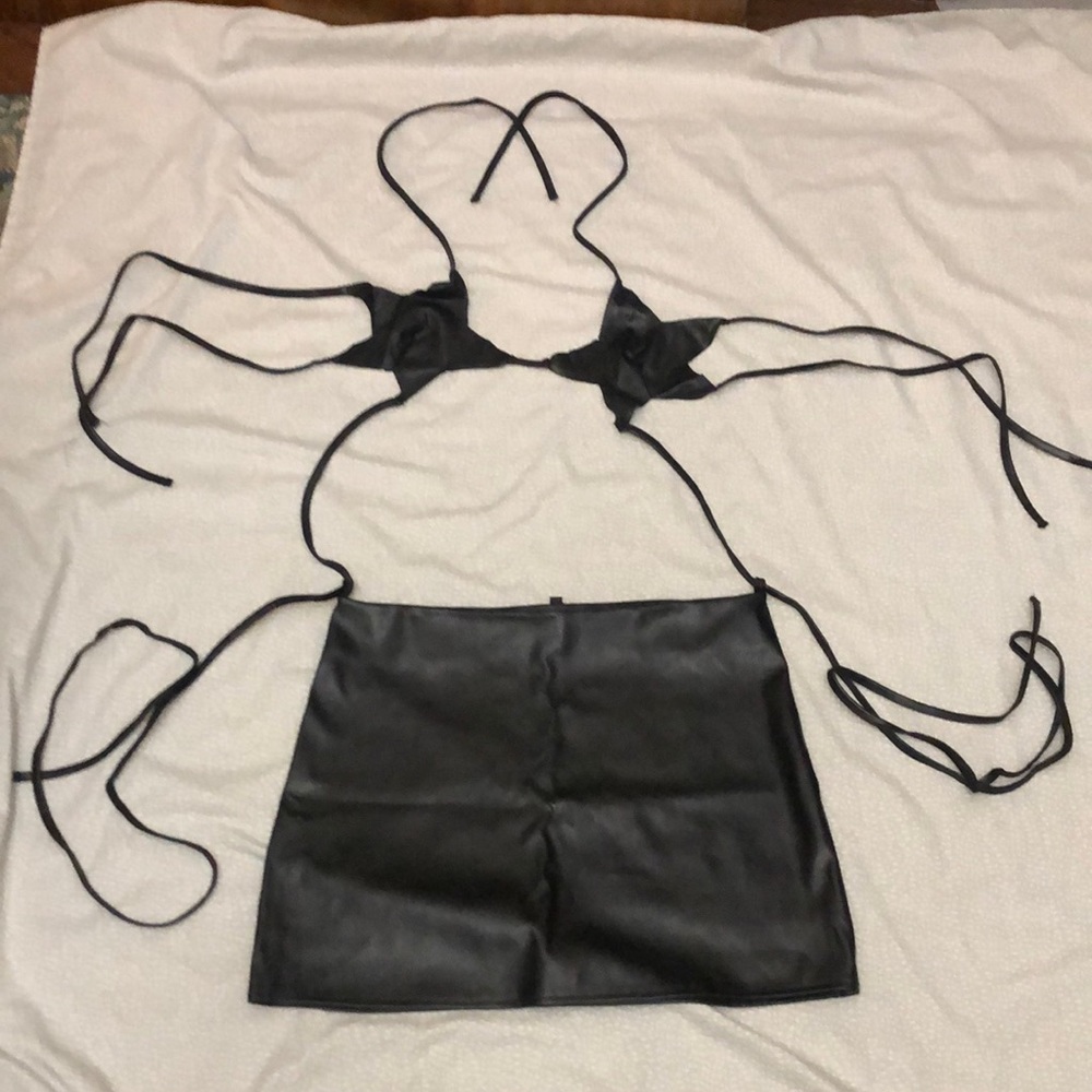 NEW LEATHER SKIRT AND MULTI STRAP TOP.size 6